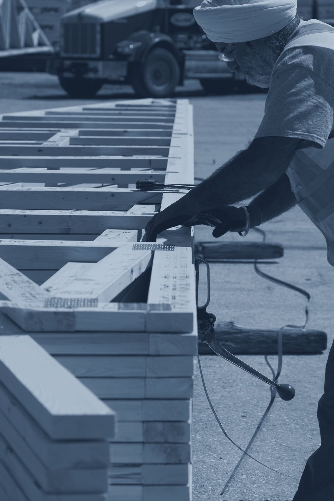 Strapping a finished truss bundle