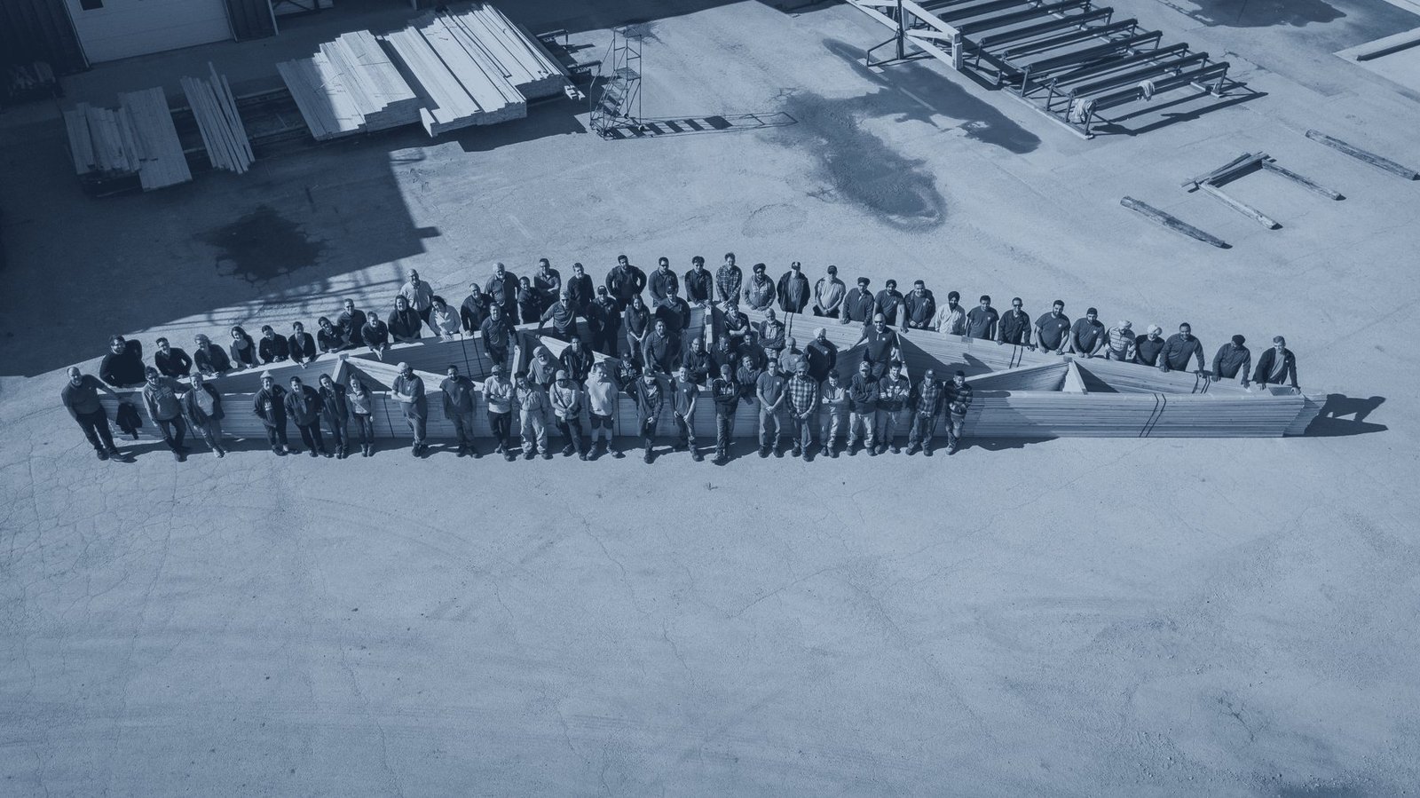 The plant team gathered in the yard